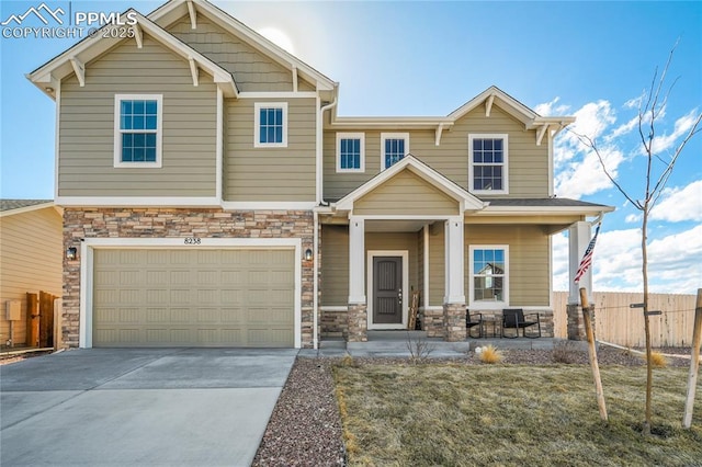 craftsman-style house featuring covered porch and a garage