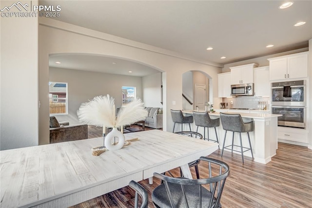 dining area with light hardwood / wood-style flooring