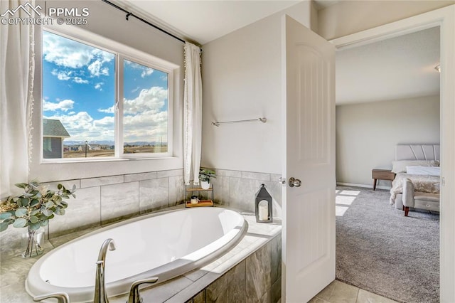 bathroom featuring tiled bath and tile patterned floors