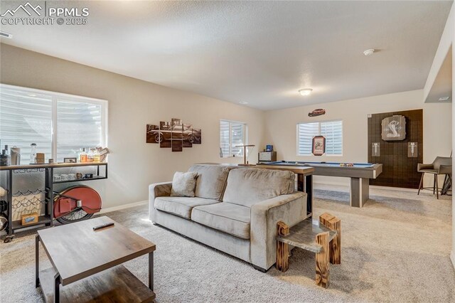 living room featuring light carpet and pool table