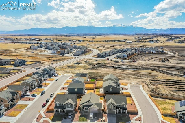 drone / aerial view featuring a mountain view