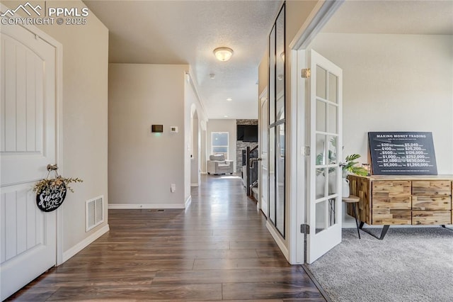 corridor featuring dark wood-type flooring