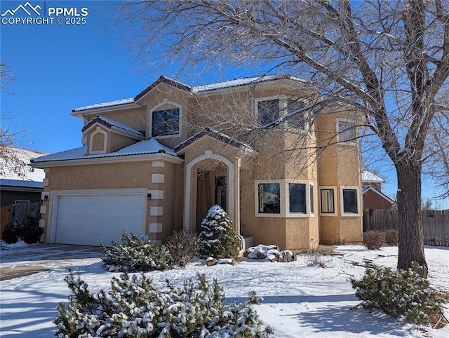 view of front of property with a garage