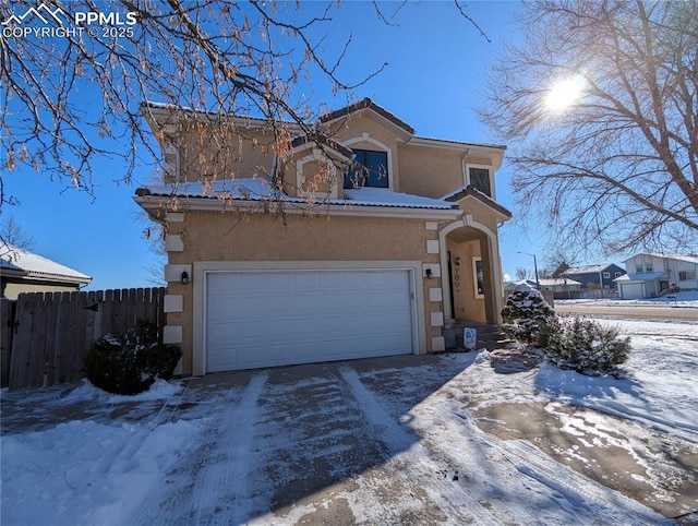 view of front of home with a garage