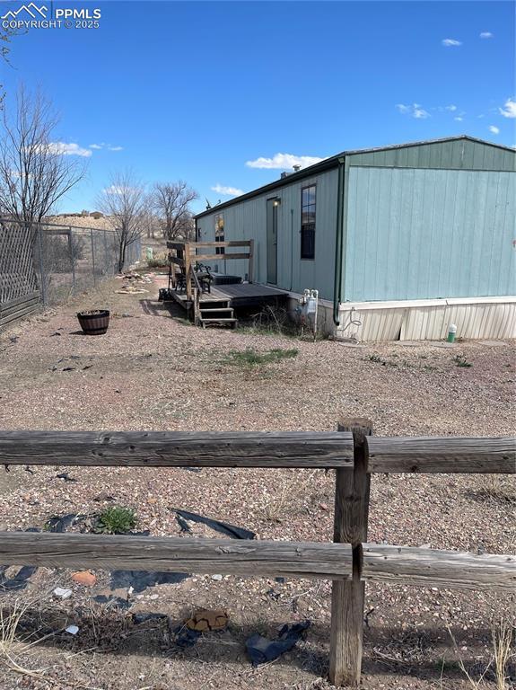 view of property exterior featuring a deck