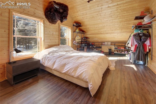 bedroom featuring hardwood / wood-style floors, lofted ceiling, wooden ceiling, and wood walls