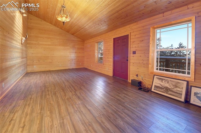 interior space with hardwood / wood-style floors, wood walls, wood ceiling, and vaulted ceiling