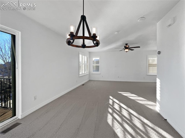 7707 Orange Sunset Dr, Colorado Springs, CO 80922 - unfurnished living room with carpet and ceiling fan with notable chandelier