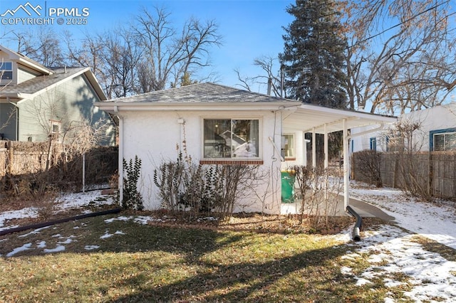 view of front of home with a yard