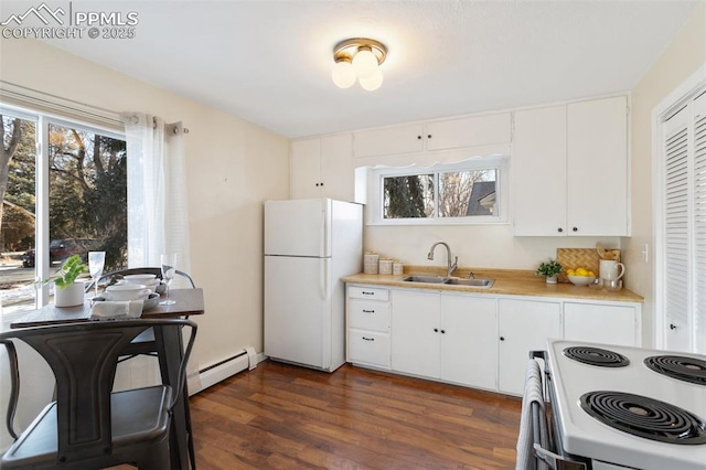 kitchen featuring white cabinetry, sink, white appliances, and dark wood-type flooring