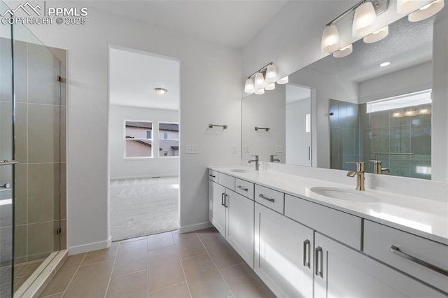 bathroom featuring tile patterned flooring, vanity, and a shower with door