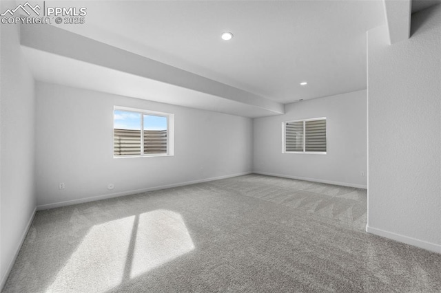 empty room featuring light colored carpet