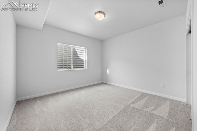 spare room with carpet floors