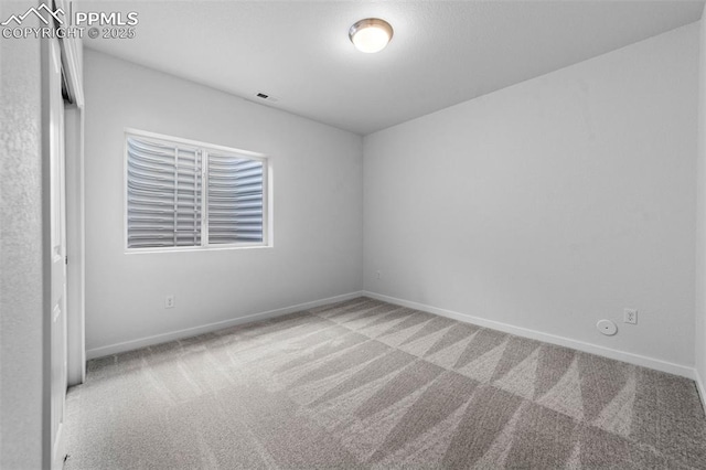 spare room with carpet flooring