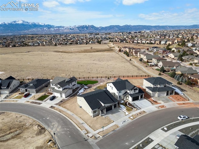 birds eye view of property featuring a mountain view