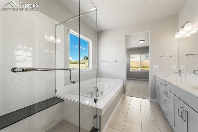 bathroom featuring tile patterned flooring, vanity, and separate shower and tub