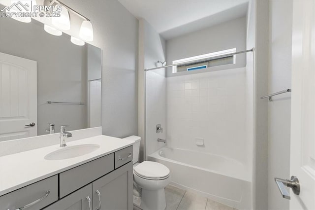 full bathroom featuring bathing tub / shower combination, tile patterned flooring, vanity, and toilet