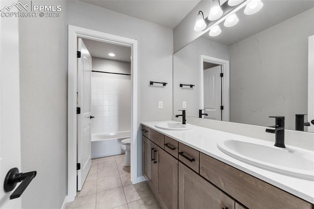 full bathroom featuring tile patterned floors, vanity, bathing tub / shower combination, and toilet