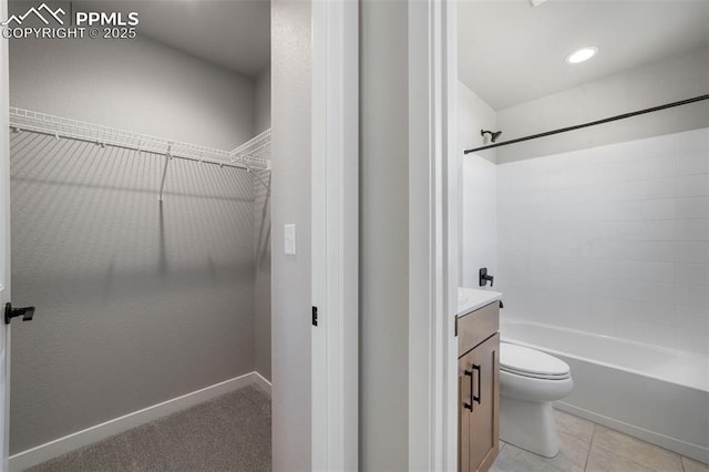 full bathroom with tile patterned floors, vanity, toilet, and tub / shower combination