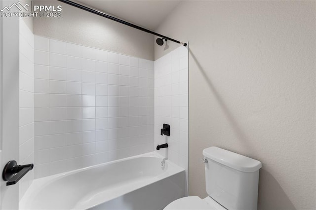 bathroom with shower / bathtub combination and toilet