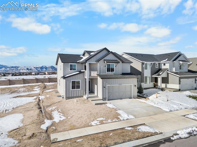 view of front of house featuring a mountain view and a garage