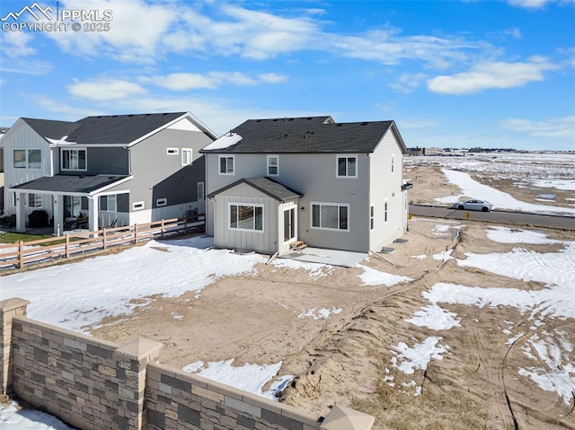 view of snow covered house