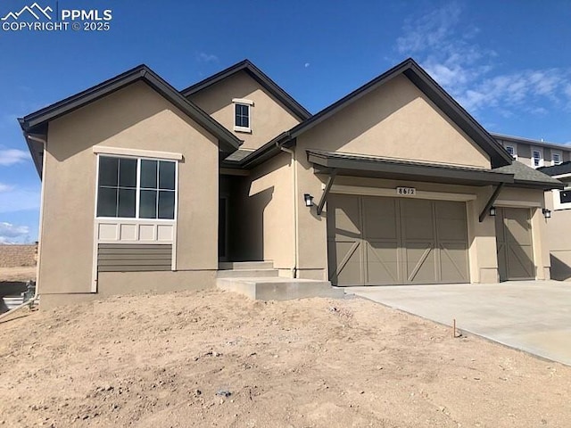 view of front of property with a garage