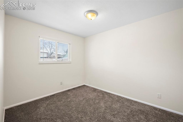 empty room featuring carpet flooring