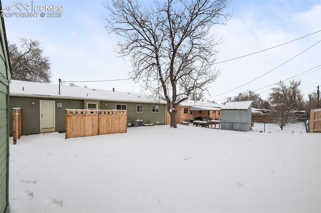 view of yard layered in snow