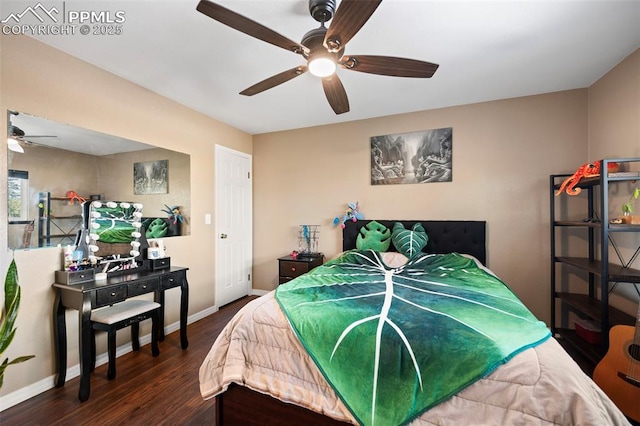 bedroom with ceiling fan and dark hardwood / wood-style flooring