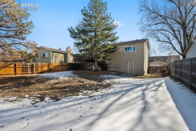 view of snow covered property