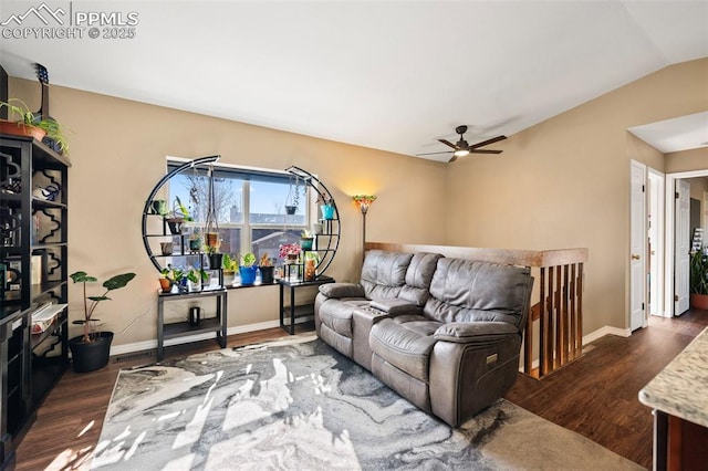 living room featuring ceiling fan, lofted ceiling, and dark hardwood / wood-style floors