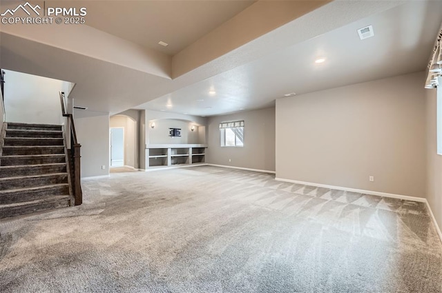 unfurnished living room with carpet