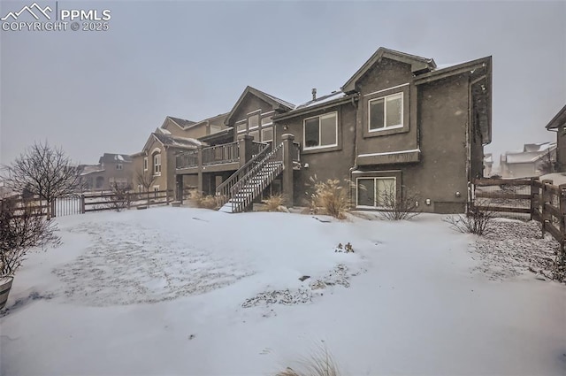 view of snow covered house