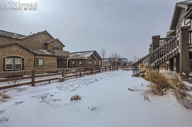 view of yard covered in snow