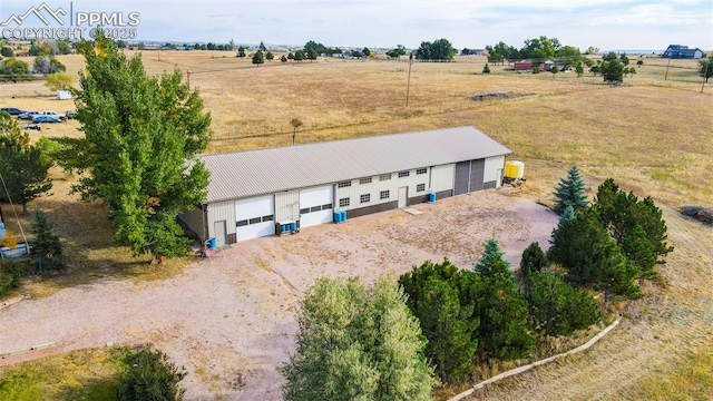 birds eye view of property with a rural view