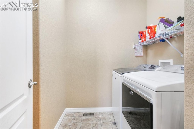 laundry room with washing machine and dryer