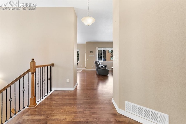 corridor featuring dark hardwood / wood-style floors