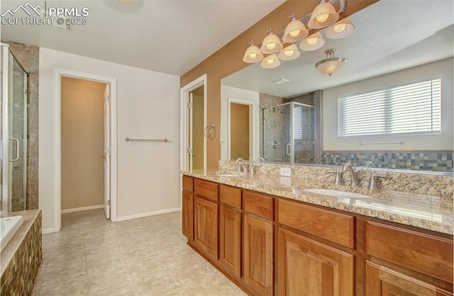 bathroom featuring shower with separate bathtub and vanity