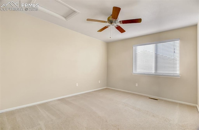 unfurnished room with ceiling fan and light carpet