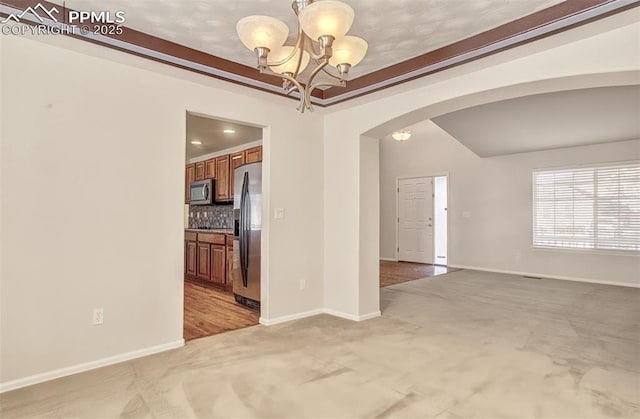 interior space featuring a chandelier and light carpet