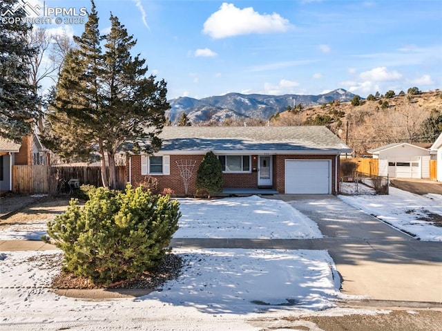 ranch-style house featuring a mountain view and a garage