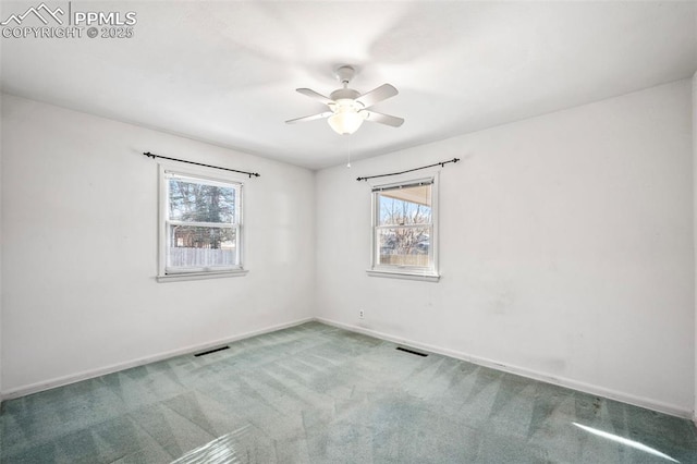 unfurnished room with ceiling fan and carpet flooring