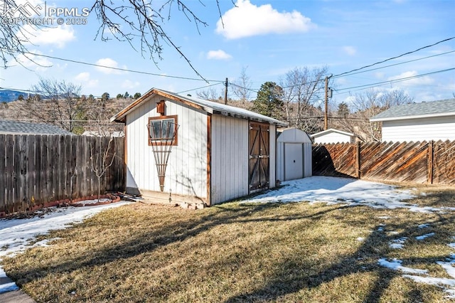 view of outbuilding with a lawn