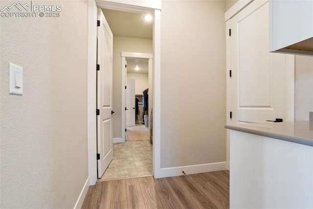 hallway with light wood-type flooring