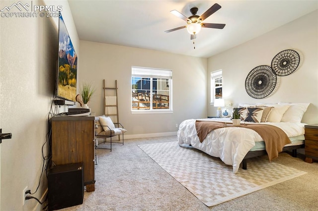 bedroom featuring ceiling fan and light colored carpet