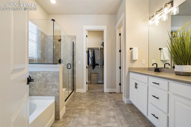 bathroom with independent shower and bath and vanity