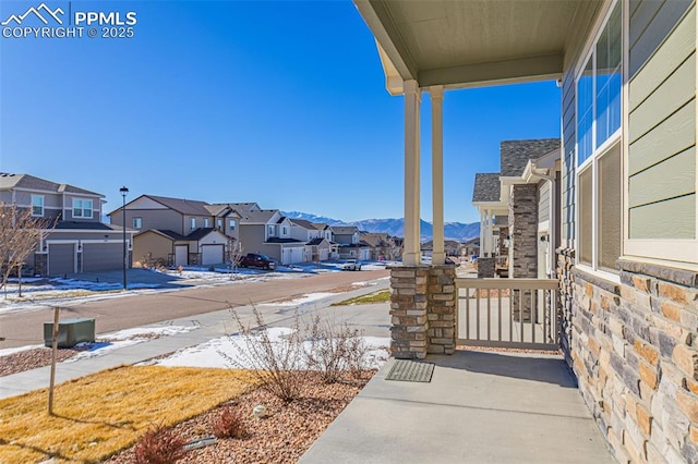 exterior space with a mountain view and a porch