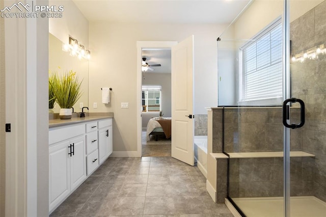 bathroom featuring ceiling fan, plenty of natural light, vanity, and separate shower and tub