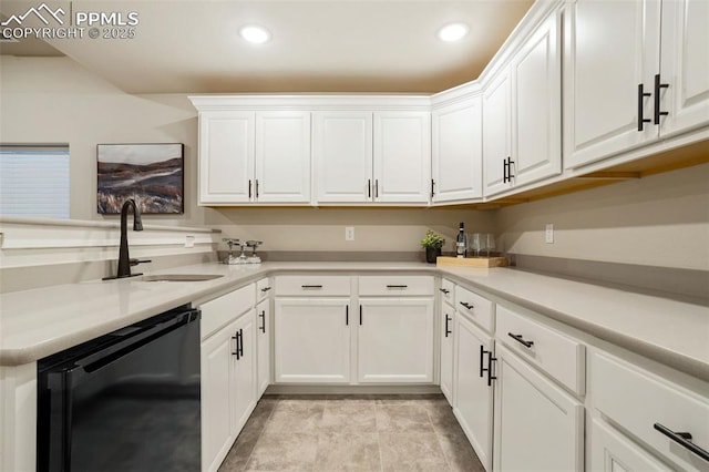 kitchen featuring dishwasher, white cabinets, and sink